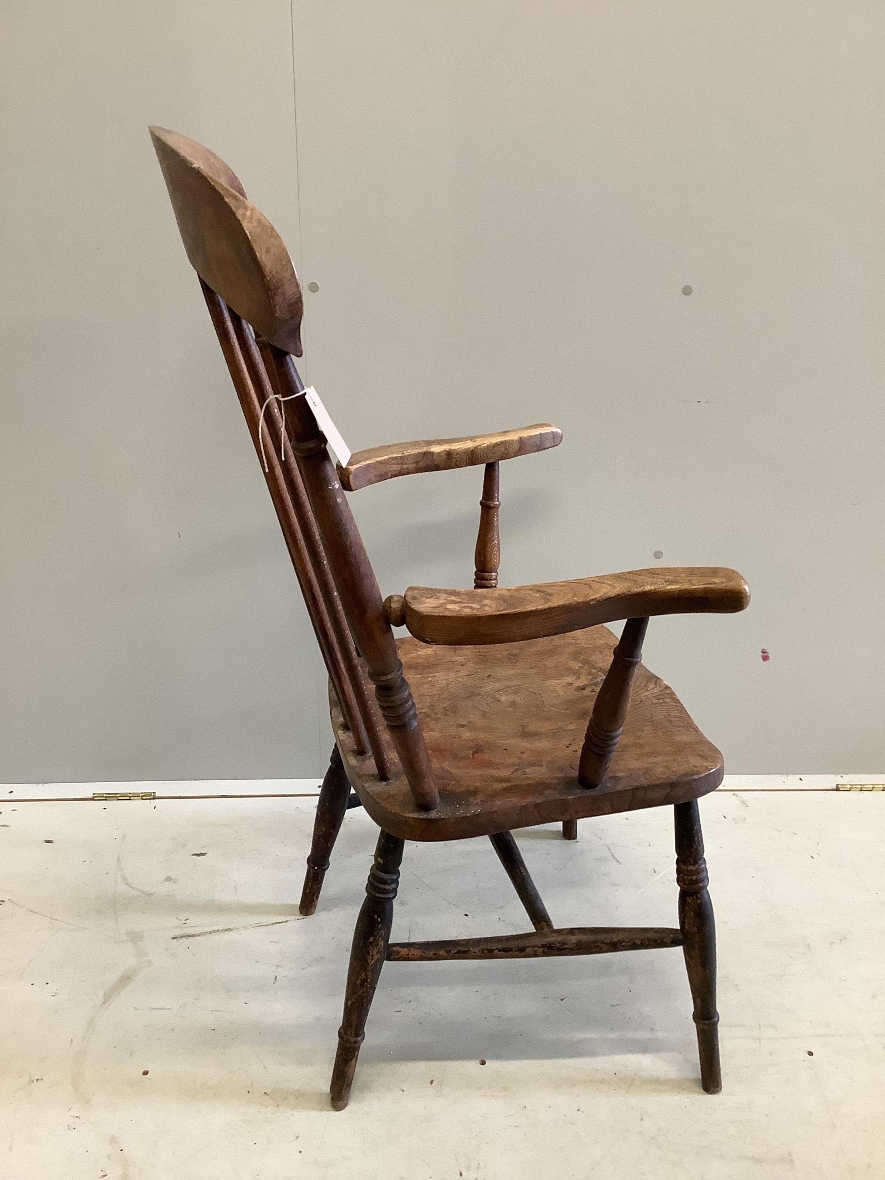 A late Victorian ash, elm and beech spindle back Windsor chair, height 113cm. Condition - fair